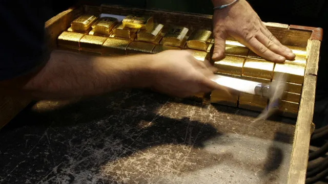 Ouro fecha em alta à espera de Fed e com alívio no Oriente Médio